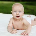 Cute baby on a organic crib mattress